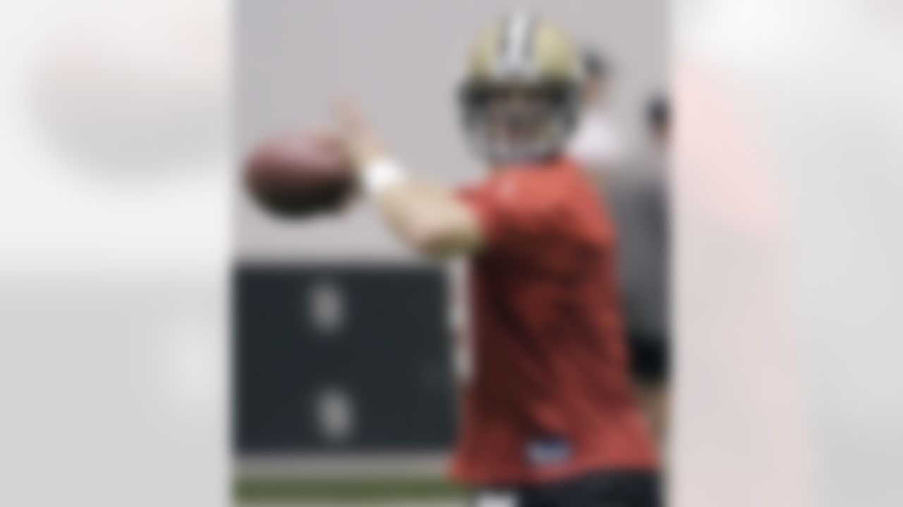 New Orleans Saints quarterback Drew Brees throws a pass during football practice at the team's NFL training facility in Metairie, La., Thursday, May 27, 2010.(AP Photo/Bill Haber)