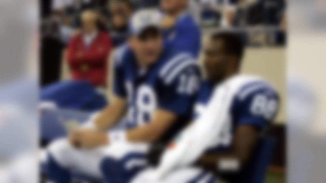 Indianapolis Colts receiver Marvin Harrison, right, and quarterback Peyton Manning sit on the bench after Harrison caught a touchdown pass from Manning in the fourth quarter against the St. Louis Rams in Indianapolis, Monday, Oct. 17, 2005. The touchdown was the 86th touchdown from Manning and Harrison, breaking the all-time record for touchdowns for a quarterback/receiver tandem.(AP Photo/Darron Cummings)