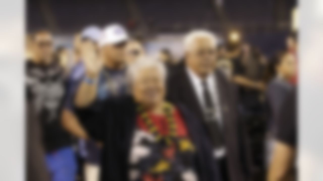 The parents of Junior Seau, Luisa and Tiaina Seau wave during a public memorial service for football player Junior Seau at Qualcomm Stadium Friday, May 11, 2012, in San Diego. Seau committed suicide on May 2 at his Oceanside, Calif., home. He played parts of 20 seasons in the NFL, with the San Diego Chargers, Miami Dolphins and New England Patriots. (AP Photo/ Gregory Bull)
