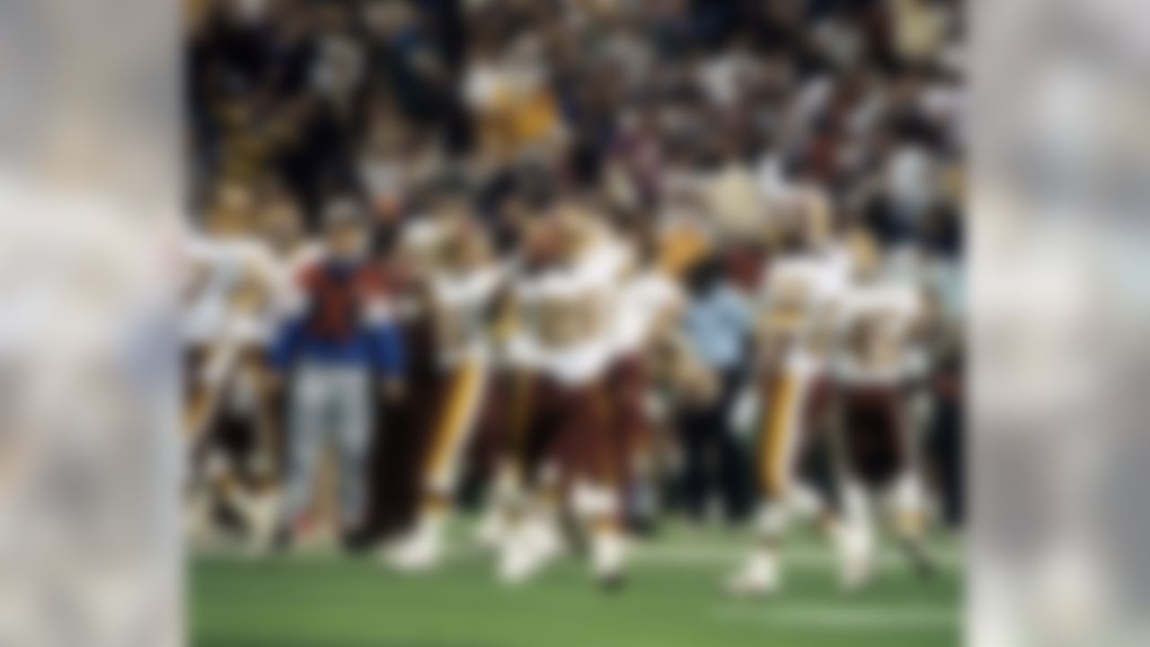 Washington Redskins cornerback Darrell Green (28) celebrates an interception during Super Bowl XXVI, a 37-24 victory over the Buffalo Bills on January 26, 1992, at the Hubert H. Humphrey Metrodome in Minneapolis, Minnesota. (AP Photo/Al Messerschmidt)