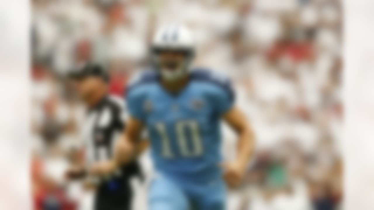 Tennessee Titans quarterback Jake Locker (10) celebrates after throwing a touchdown pass during an NFL football game against the Houston Texans at Reliant Stadium on September 15, 2013 in Houston, Texas. Houston won 30-24. (Aaron M. Sprecher/NFL)