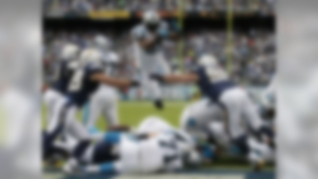 Carolina Panthers fullback Mike Tolbert goes airborne to score a touchdown against the San Diego Chargers. (AP Photo/Gregory Bull)