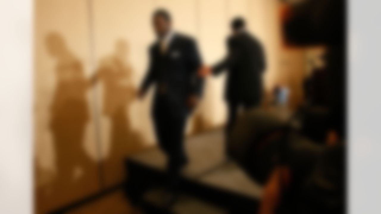RICHMOND, VA - AUGUST 27: NFL star Michael Vick leaves the stage after speaking at a press conference following an appearing in federal court August 27, 2007 in Richmond, Virginia. Vick pleaded guilty in court to federal dogfighting conspiracy charges. (Photo by Win McNamee/Getty Images)