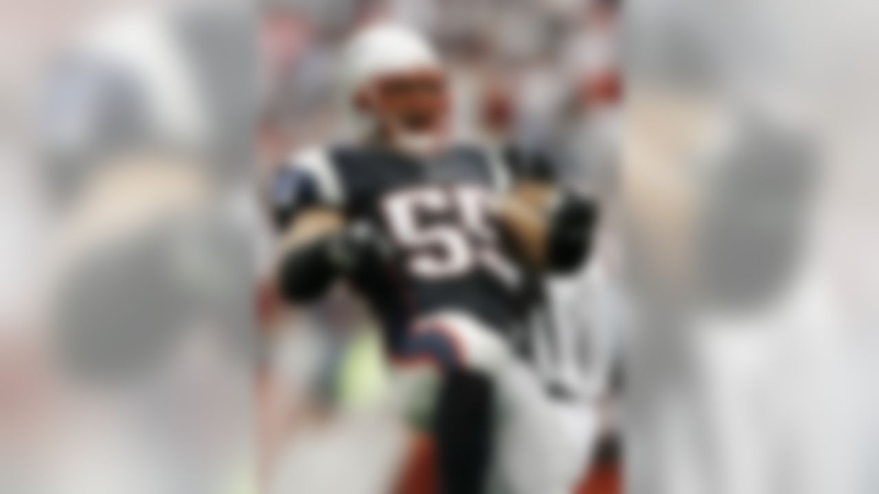 New England Patriots linebacker Junior Seau reacts after the first of his two interceptions against the Cleveland Browns in a football game at Gillette Stadium in Foxborough, Mass. (AP Photo/Winslow Townson)