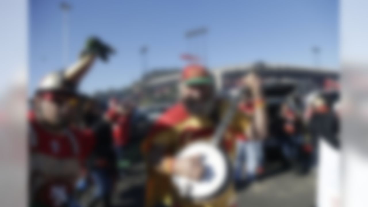 San Francisco 49ers fans tailgate outside Candlestick Park before an NFL football game against the Seattle Seahawks, Sunday, Dec. 8, 2013, in San Francisco. (AP Photo/Marcio Jose Sanchez)