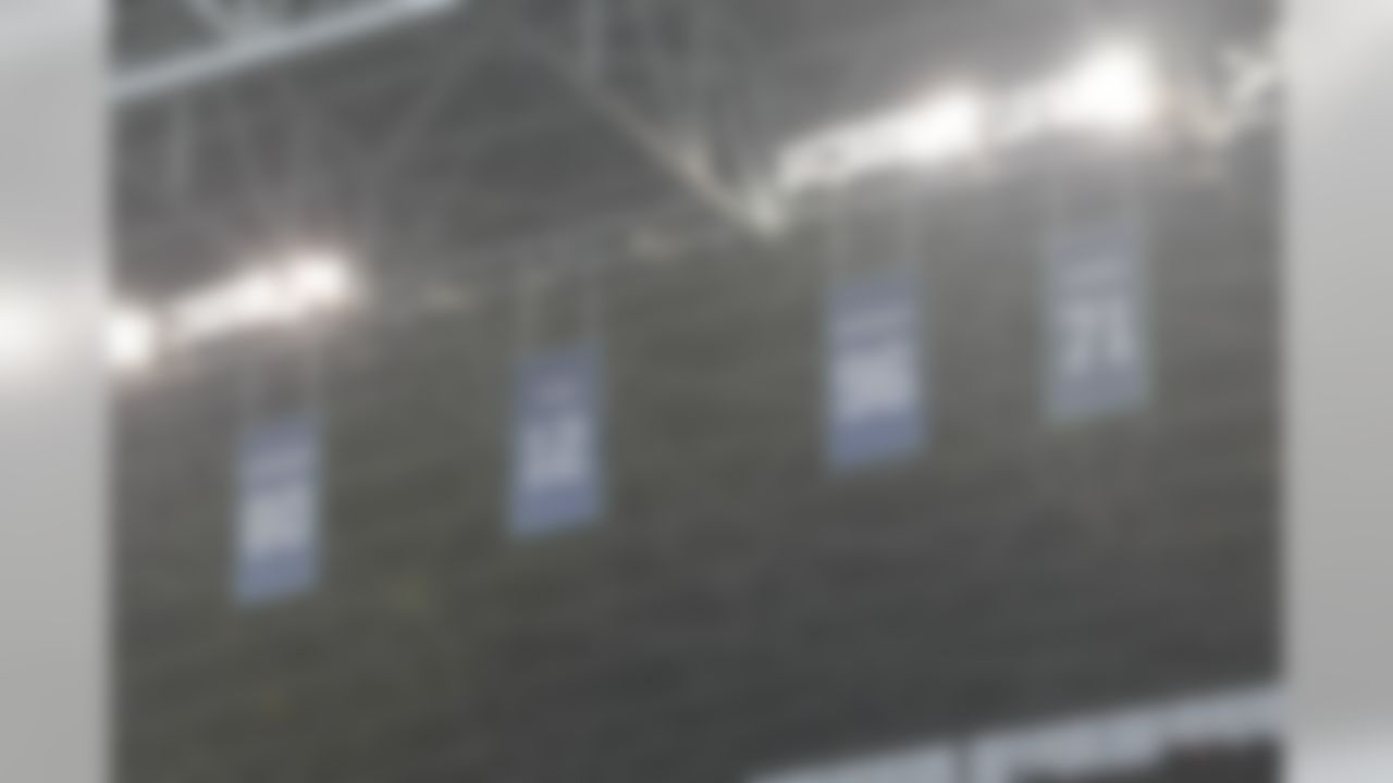 Numbers of Seattle Seahawks great Cortez Kennedy #96 hangs with Walter Jones' #71, Steve Largent's #80, and the #12 dedicated to Seahawks fans hang in the rafters of CenturyLink Field on Sunday, Oct. 14, 2012, in Seattle. (AP Photo/John Froschauer)