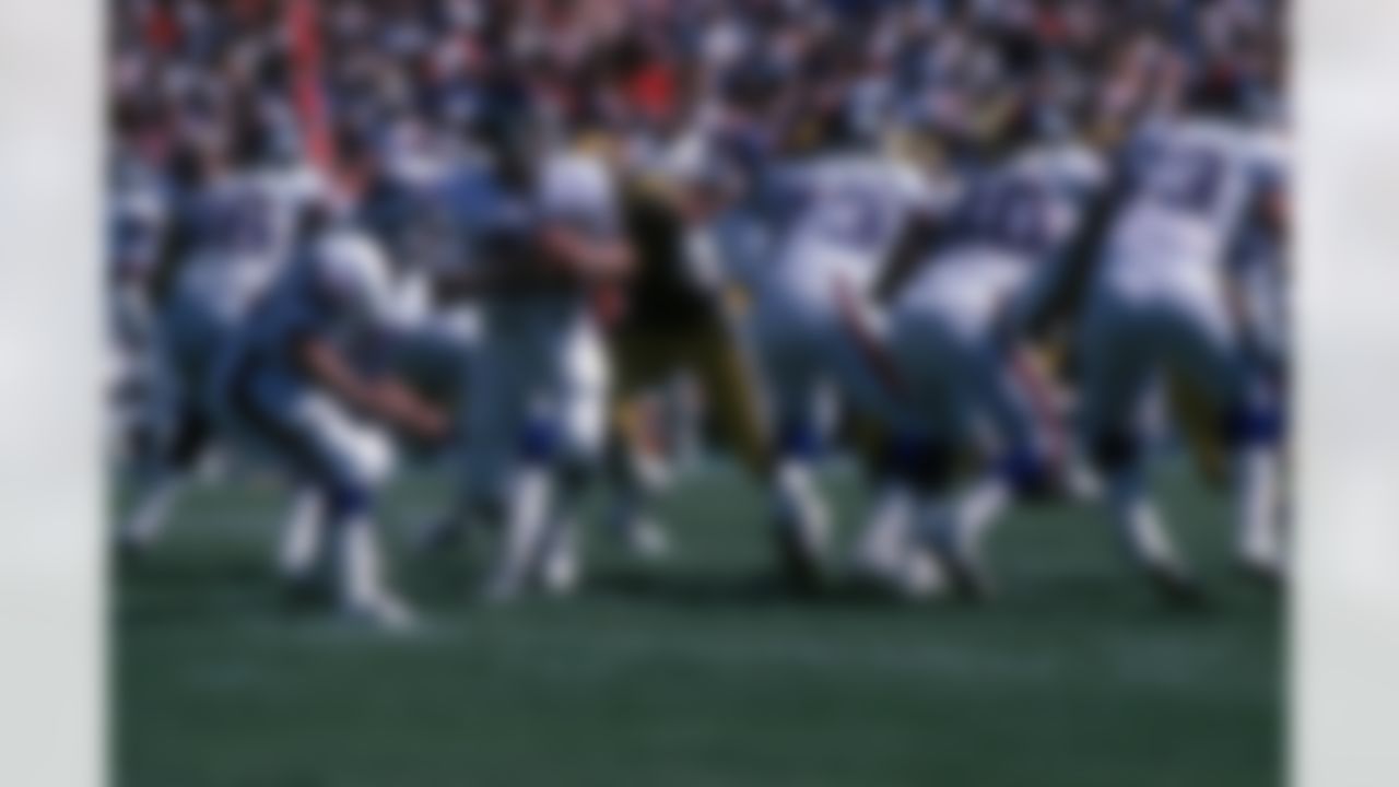 Quarterback Phil Simms #11 of the New York Giants drops back to pass as running back Rob Carpenter #26 sets up to block against the Los Angeles Rams at Anaheim Stadium on September 30, 1984 in Anaheim, California. The Rams defeated the Giants 33-12. (National Football League)