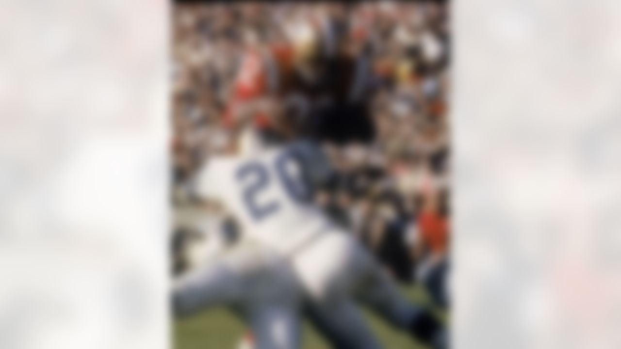 Cleveland Browns running back Jim Brown #32 of the East is wrapped up by Baltimore Colts defensive back Jerry Logan #20 of the West in the 1966 NFL Pro Bowl at the Los Angeles Memorial Coliseum on January 15, 1966 in Los Angeles, California. The East defeated the West 36-7. (National Football League)