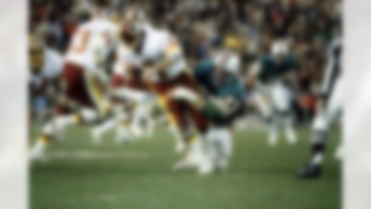 Miami Dolphins nose tackle Bob Baumhower sacks Washington Redskins quarterback Joe Theismann during the Dolphins 27 - 17 loss in Super Bowl XVII on January 30, 1983 at the Rose Bowl in Pasadena, CA. (AP Photo/Al Messerschmidt)
