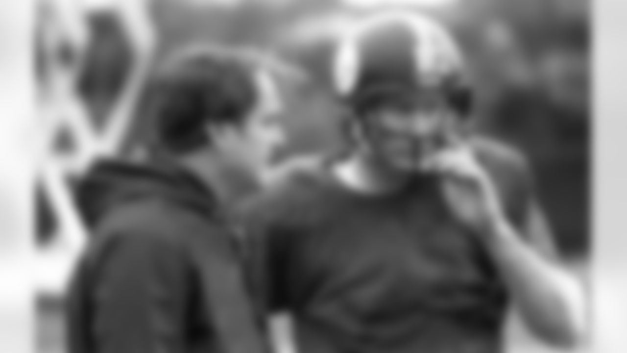 Pittsburgh Steelers coach Chuck Noll, left, and quarterback Terry Bradshaw confer during a practice session at their Cal State Fullerton training camp, Thursday, Jan. 18, 1980. They are preparing for their Sunday meeting with the Los Angeles Rams in the Super Bowl. (AP Photo/Harry Cabluck)