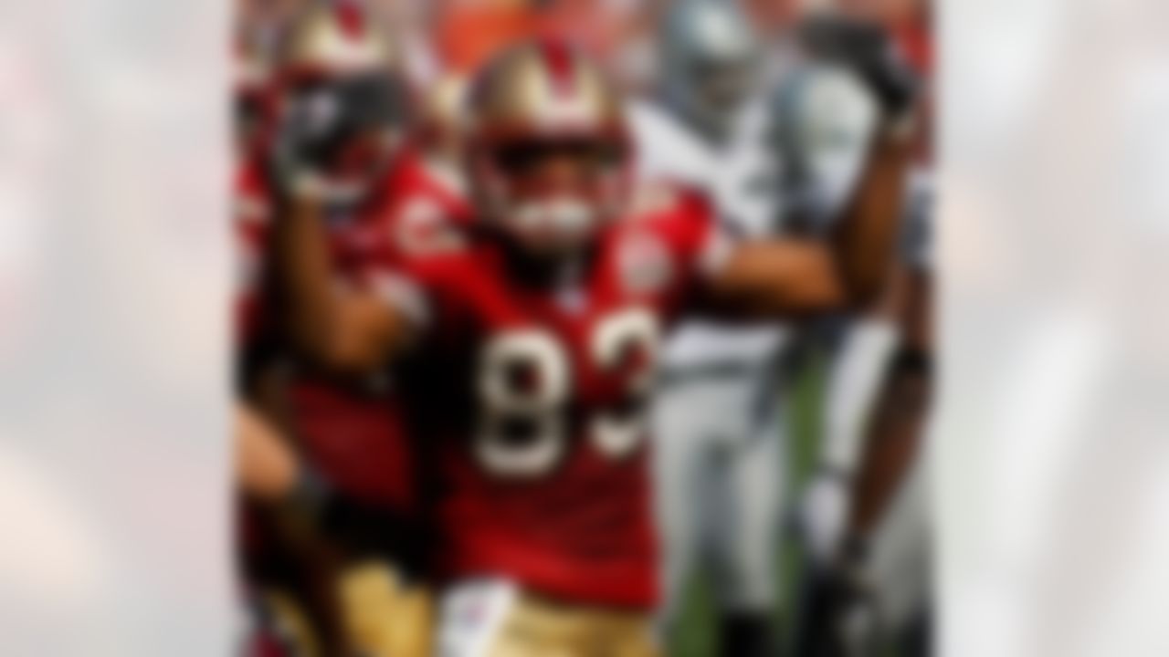 Arnaz Battle of the San Francisco 49ers celebrates after scoring on a 4-yard pass in the first quarter of 34-20 victory over the Oakland Raiders at Monster Park in San Francisco, Calif. on Sunday, October 8, 2006. Battle caught two touchdowns after just three TDs in his previous 36 NFL games. Photo by Getty Images.
