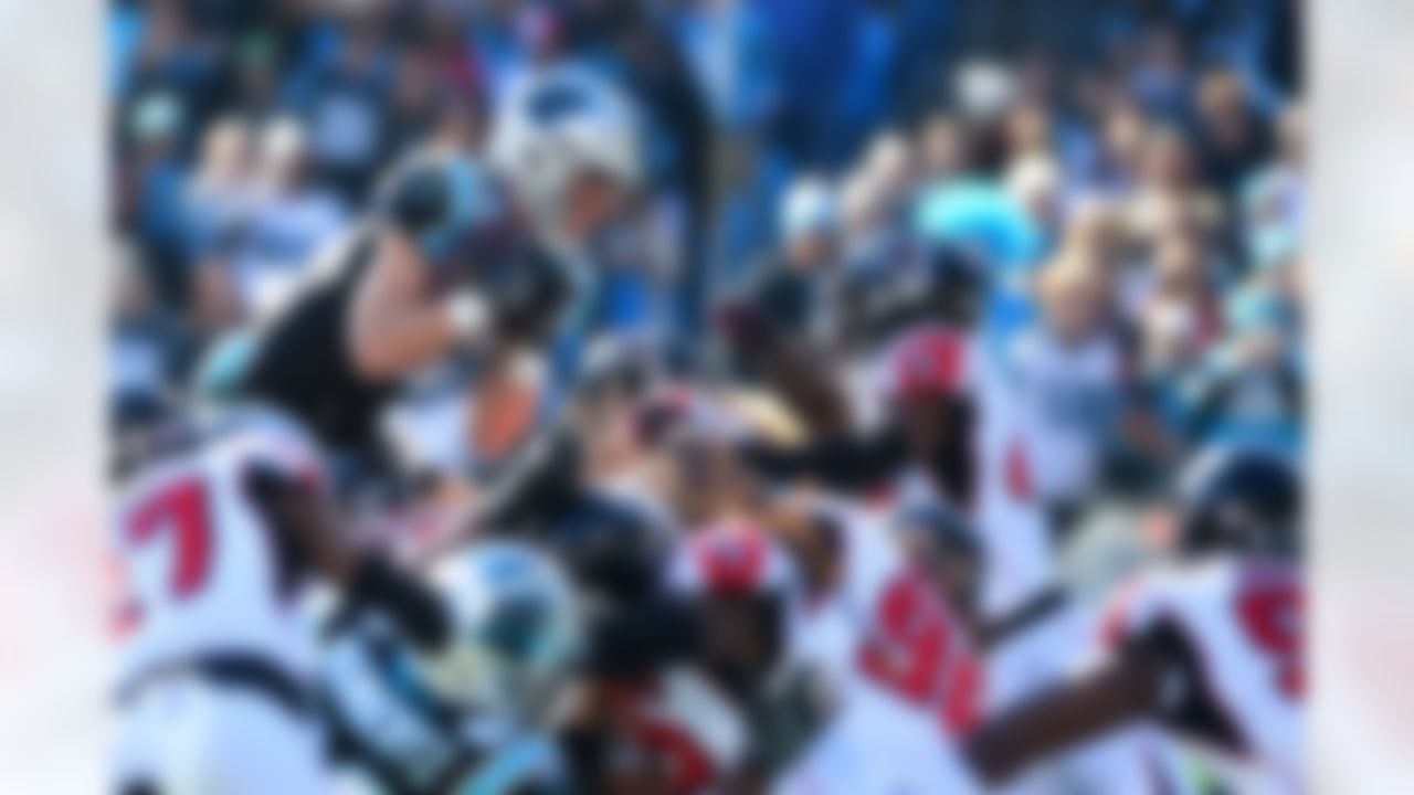 Carolina Panthers running back Christian McCaffrey (22) tries to go over the pile with the ball in the first quarter at Bank of America Stadium on December 23, 2018 in Charlotte, N.C.