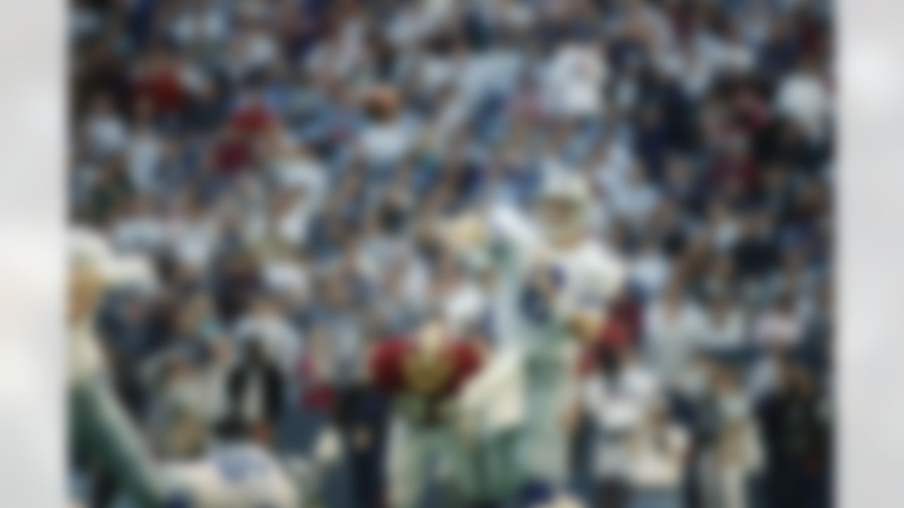 Dallas Cowboys quarterback Troy Aikman throws against the Washington Redskins in the second quarter of the Cowboys' 38-3 win, Sunday, Dec. 26, 1993 in Irving, Texas. Aikman completed 16 of 20 passes for 193 yards. (AP Photo/Pat Sullivan)