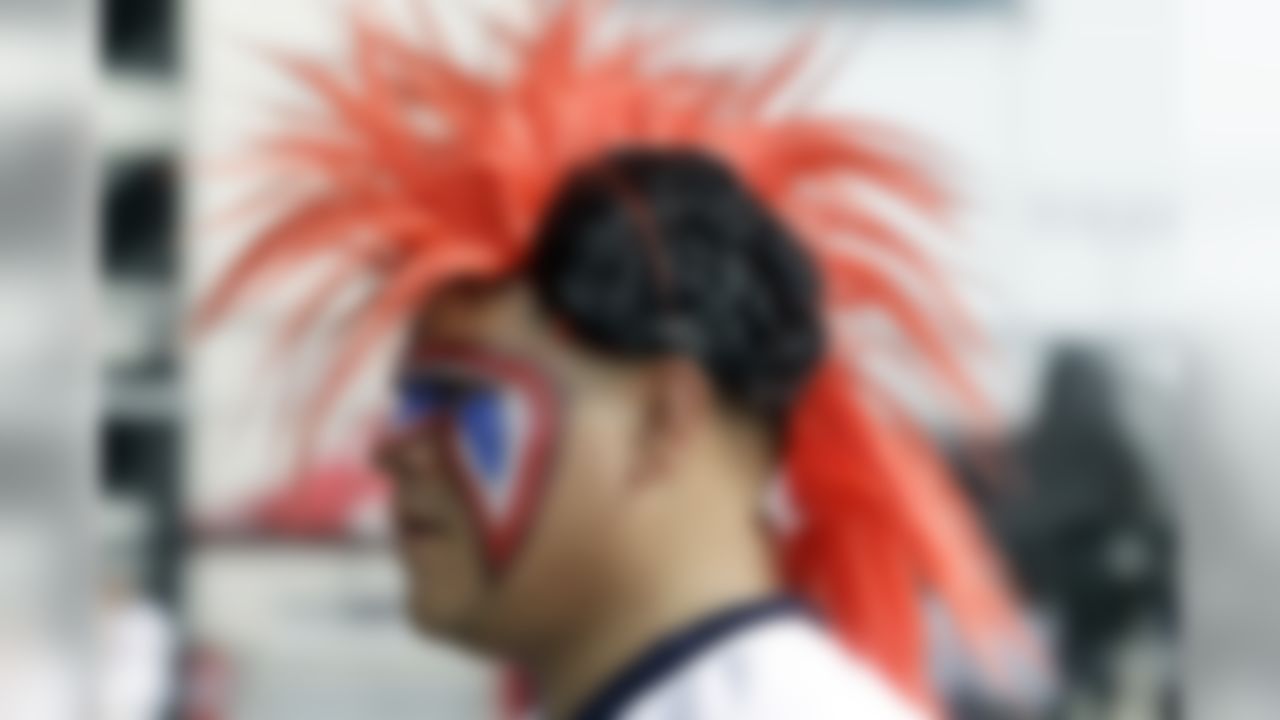 A Houston Texans fan arrives for an NFL football game against the Tennessee Titans, Sunday, Sept. 15, 2013, in Houston. (AP Photo/Patric Schneider)