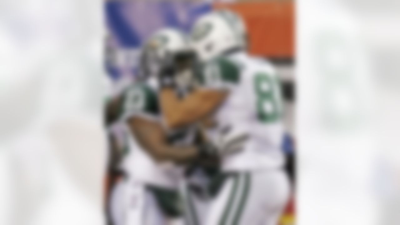 New York Jets tight end Dustin Keller (81) congratulates New York Jets running back Shonn Greene (23) after Greene scored a touchdown against the Cincinnati Bengals in the first half of an NFL wild-card playoff football game, Saturday, Jan. 9, 2010, in Cincinnati. (AP Photo/David Kohl)