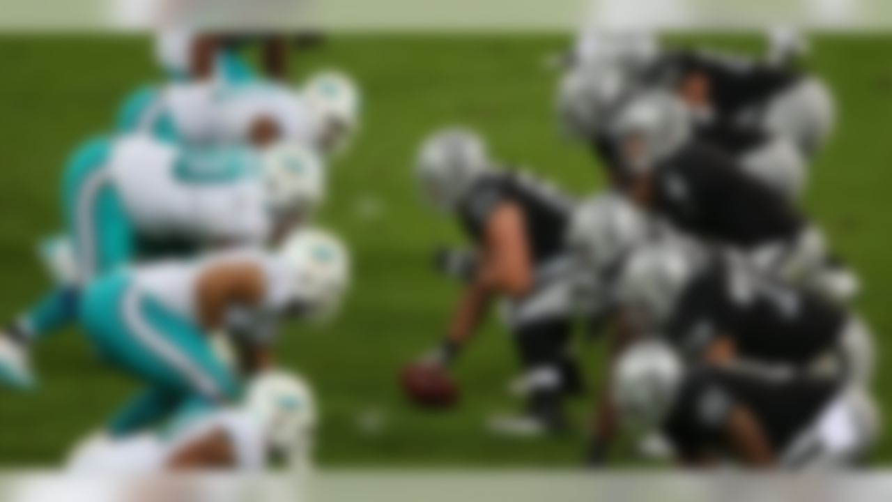 Oakland Raiders center Stefen Wisniewski (61) prepares to snap the ball against the Miami Dolphins. (Dave Shopland/NFL)