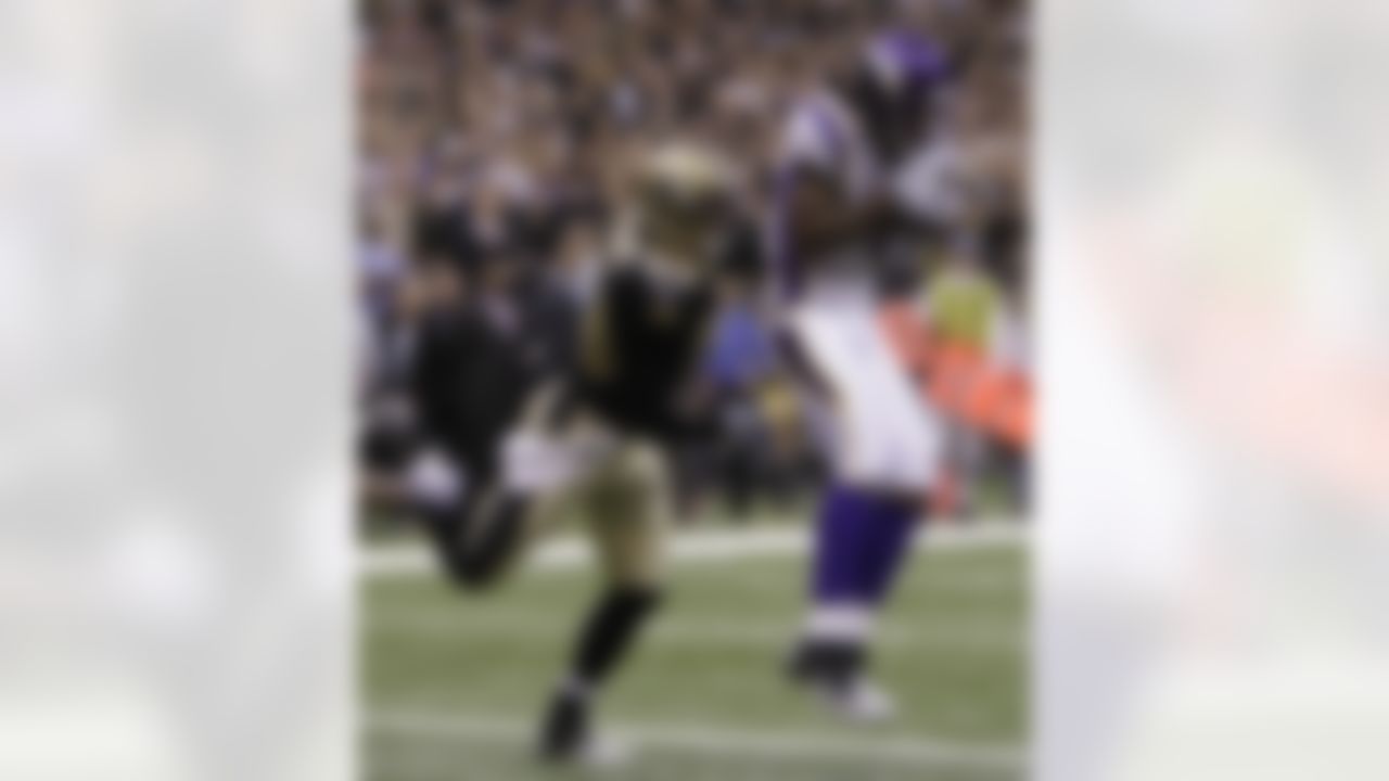 Minnesota Vikings wide receiver Sidney Rice (18) catches a ball for a 5-yard touchdown against New Orleans Saints linebacker Scott Shanle (58) during the first quarter of the NFC Championship NFL football game against the New Orleans Saints in New Orleans, Sunday, Jan. 24, 2010. (AP Photo/Mark Humphrey)