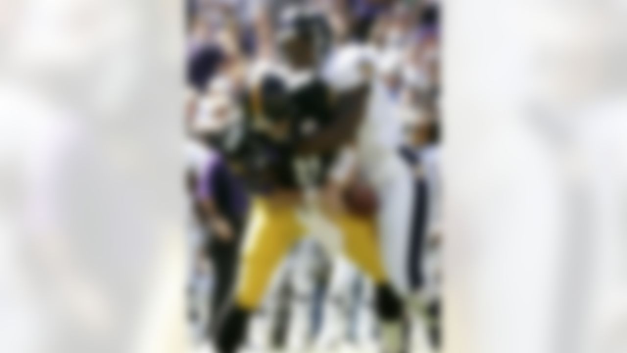 Baltimore Ravens linebacker Terrell Suggs, right, sacks Pittsburgh Steelers quarterback Tommy Maddox during the first quarter Sunday, Sept. 19, 2004, in Baltimore. The Ravens won 30-13. (AP Photo/Chris Gardner)