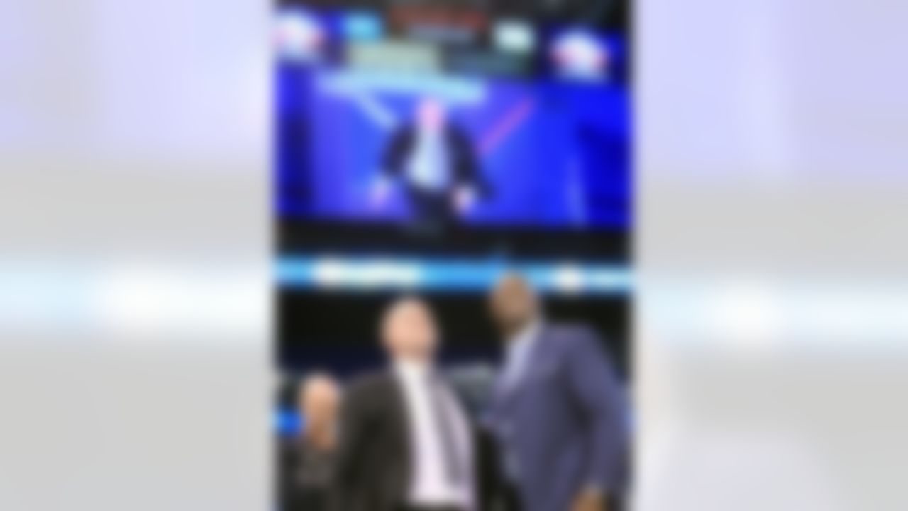 NFL Network host Rich Eisen and Charles Davis watch the 40 yard dash on a big screen at the 2012 NFL Scouting Combine at Lucas Oil Stadium on Feb. 27 in Indianapolis, Ind. (Ben Liebenberg/NFL)