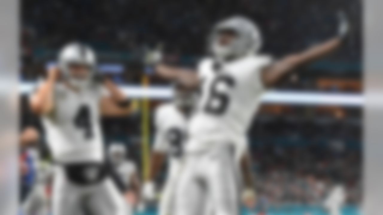 Oakland Raiders wide receiver Johnny Holton (16) celebrates his touchdown against the Miami Dolphins during the first half at Hard Rock Stadium.