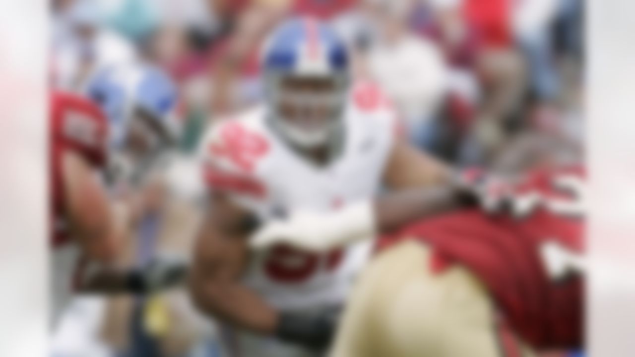 New York Giants defensive end Michael Strahan (92) rushes the quarterback during an NFL game against the San Francisco 49ers, Nov. 6, 2005 in San Francisco. (AP Photo/Greg Trott)