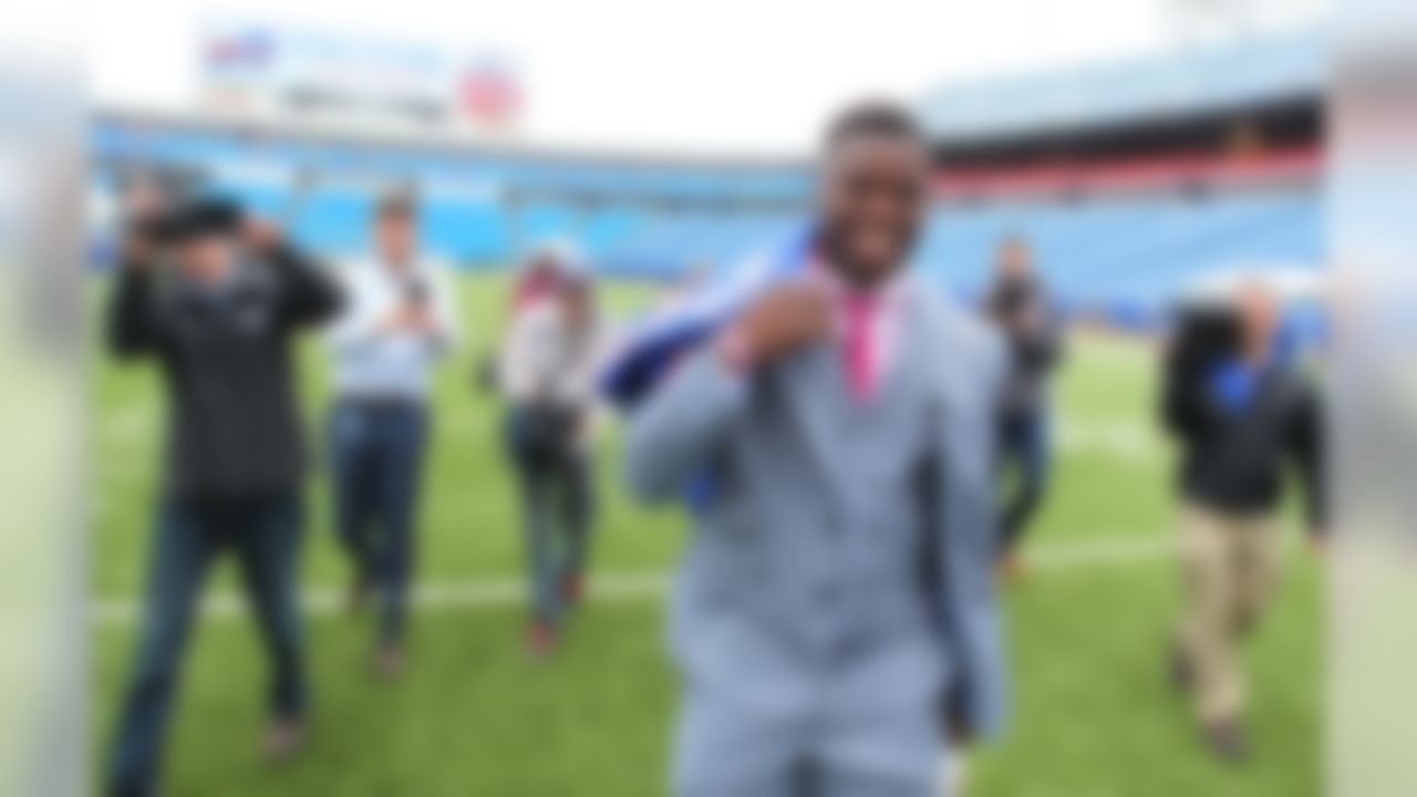 Buffalo Bills first round NFL football draft pick Shaq Lawson walks off the field following a media conference at Ralph Wilson Stadium in Orchard Park, N.Y., Friday, April 29, 2016. (AP Photo/Bill Wippert)