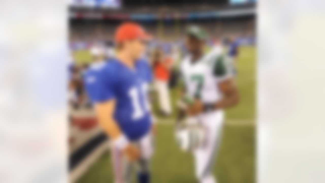 New York Giants quaterback Eli Manning (10) talks with former team mate Plaxico Burress (17) after an NFL football game against the New York Jets on Monday August 29, 2011 at MetLife Stadium in East Rutherford, New Jersey
(AP Photo/Evan Pinkus)