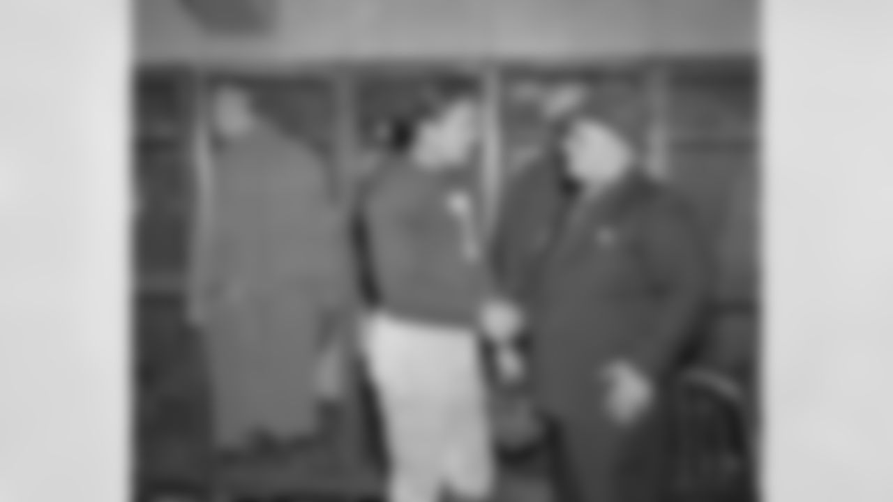 Capt. Mel Hein, left, says goodbye to coach Steve Owen on Dec. 6, 1942 in New York, after the New York Giants' center helped teammates whip the Brooklyn Dodgers 10-0. (Associated Press)