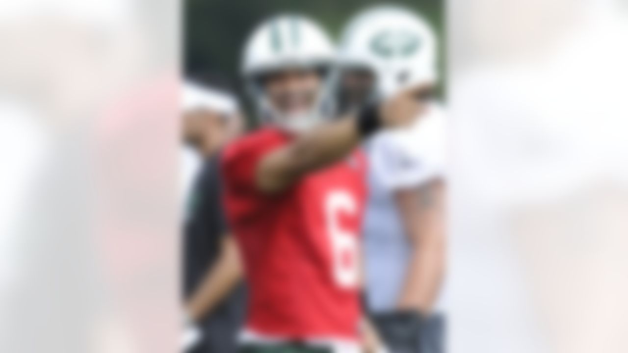 New York Jets quarterback Mark Sanchez reacts during practice on opening day of their NFL football training camp Friday, July 27, 2012, in Cortland, N.Y. (AP Photo/Bill Kostroun)