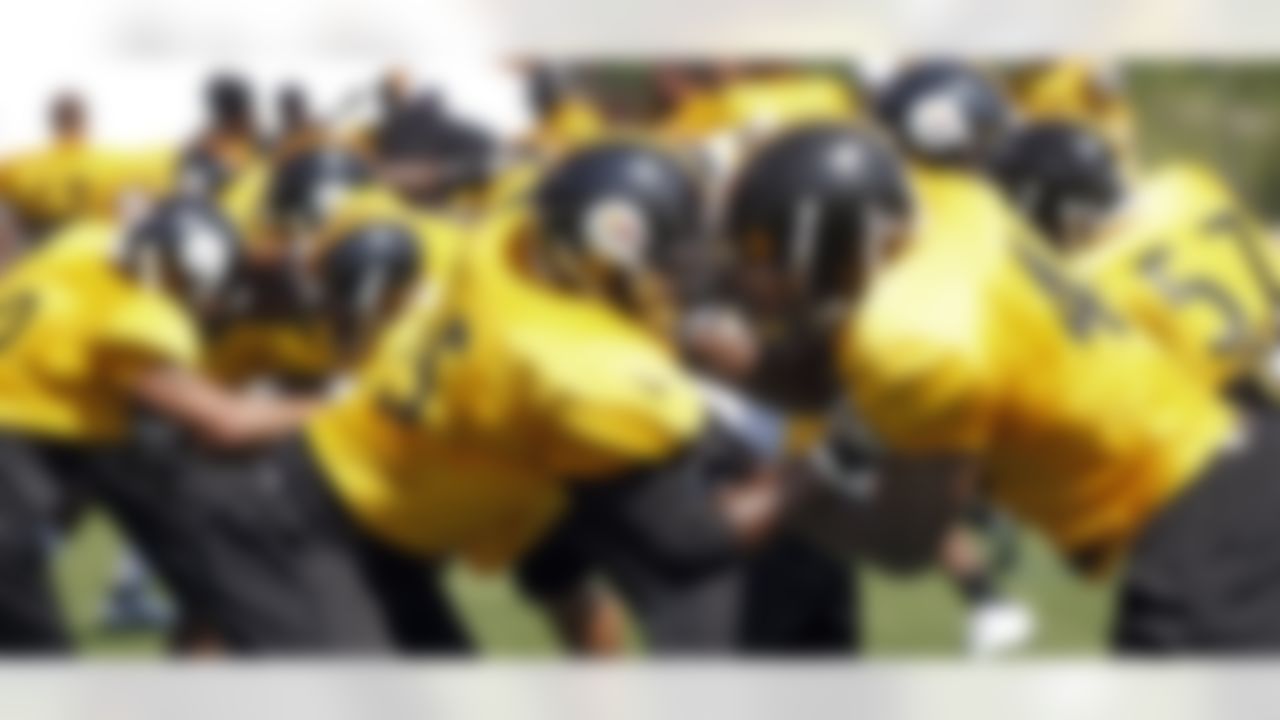 Pittsburgh Steelers linebackers Stevenson Sylvester, center left, and Will Johnson, center right, go through contact drills with the rest of the linebackers during practice at NFL football training camp in Latrobe, Pa., Sunday, July 29, 2012. (AP Photo/Keith Srakocic)