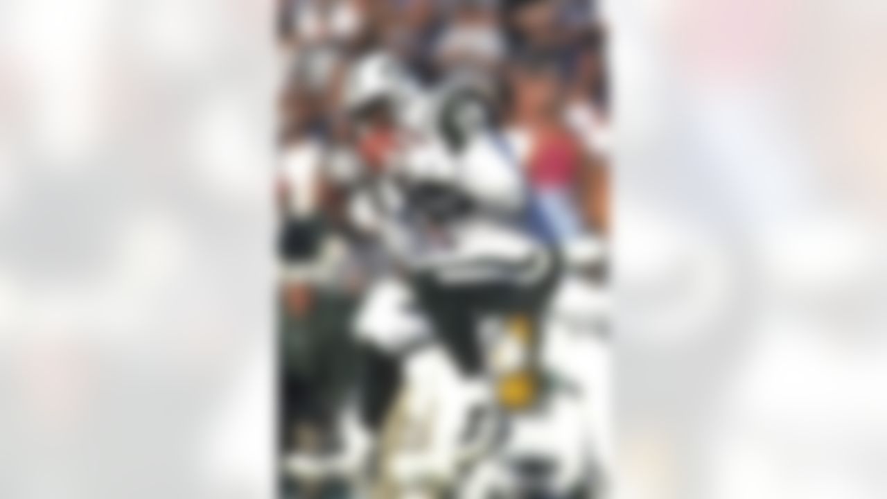 New York Jets wide receiver Keyshawn Johnson (19) catches a pass during an NFL game against the Oakland Raiders on Sunday, Oct. 24, 1999, in Oakland. The Raiders won the game, 24-23.