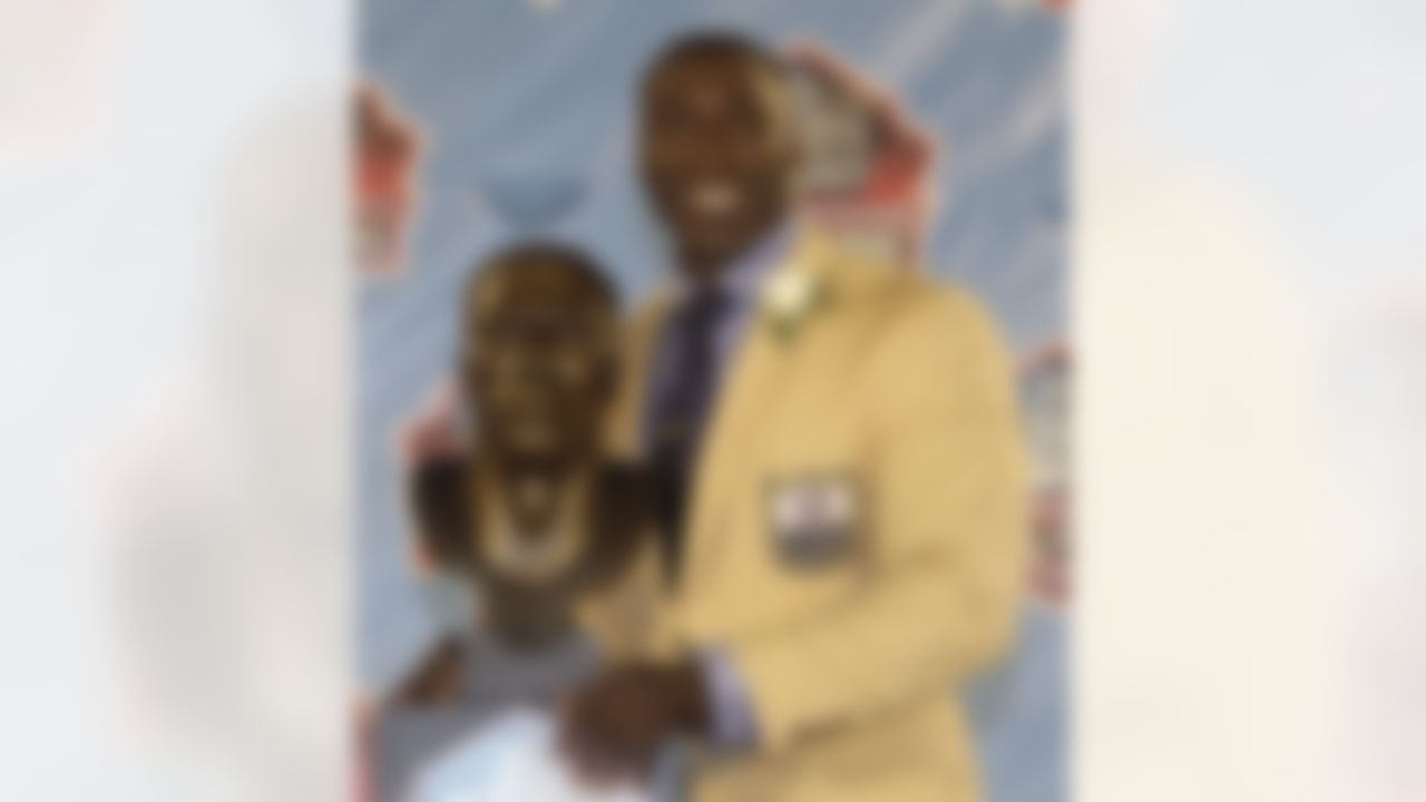 Shannon Sharpe poses with a bust of himself during his induction ceremony at the Pro Football Hall of Fame on Saturday, Aug. 6, 2011, in Canton, Ohio. (AP Photo/Tony Dejak)