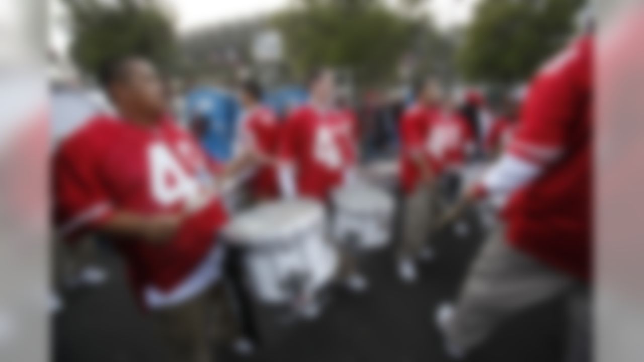 Football fans tailgate before an NFL football game between the Arizona Cardinals and the San Francisco 49ers in San Francisco, Monday, Dec. 14, 2009. (AP Photo/Paul Sakuma)