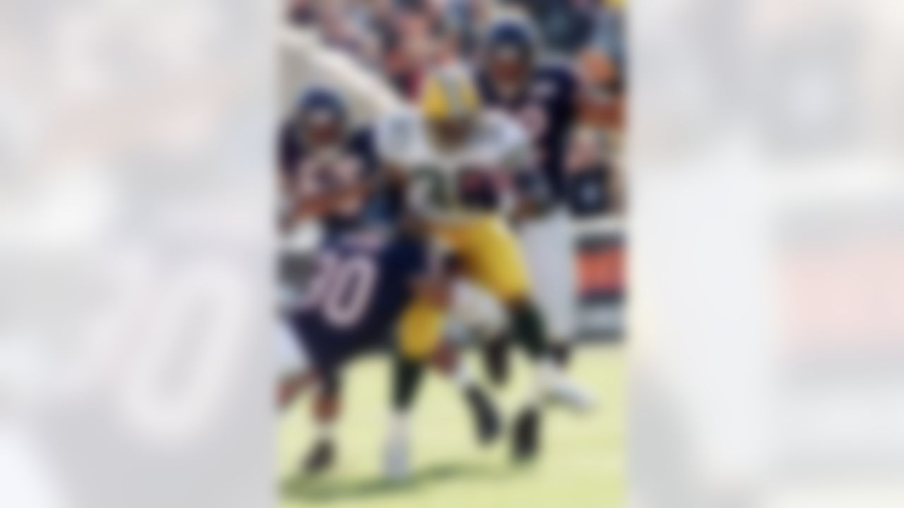 Green Bay Packers' Ahman Green (30) breaks through the Chicago Bears' defense for a 24-yard gain in the second quarter at Soldier Field in Chicago, Ill., Sunday, Nov. 11, 2001. (AP Photo/Ted S. Warren)