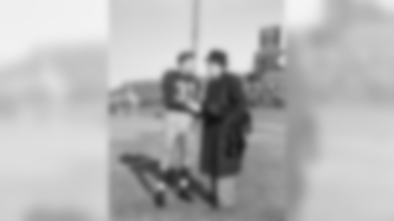 Sammy Baugh, the almost everlasting passing wonder shakes hands with George P. Marshall, President of the Washington Redskins, December 14, 1952 . (Associated Press)