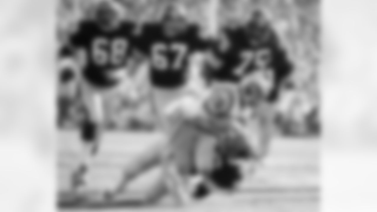 Los Angeles Rams running back Wendell Tyler (26) is thrown for 4-yard loss by Pittsburgh Steelers linebacker Jack Lambert (58) as Steelers; L.C. Greenwood (68), Gary Dunn (67) and Joe Greene (75) during first quarter of Super Bowl XIV at the Rose Bowl in Pasadena, Calif. (Associated Press)