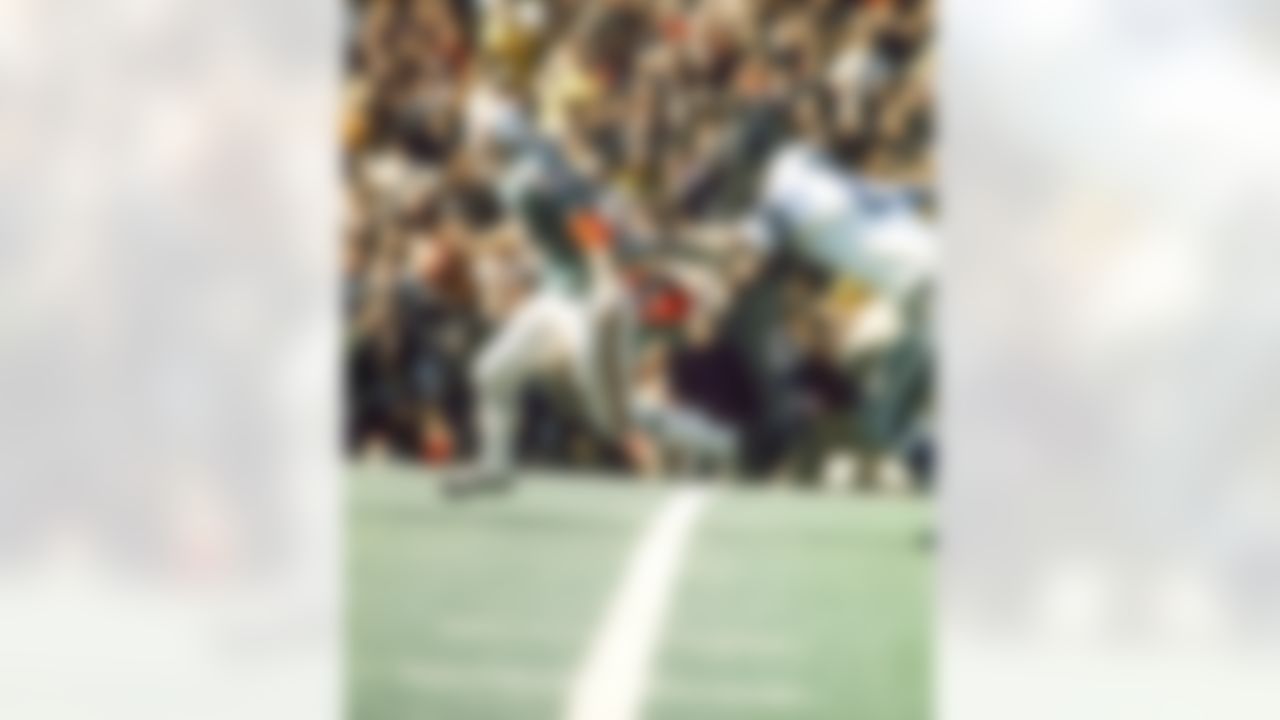 Miami quarterback Bob Griese tries to elude Dallas defensive tackle Bob Lilly on what would become a 29-yard loss after he was sacked in the Cowboys 24-3 win over the Miami Dolphins in Super Bowl VI on January, 16 1972 at Tulane Stadium in New Orleans, Louisiana. (National Football League)