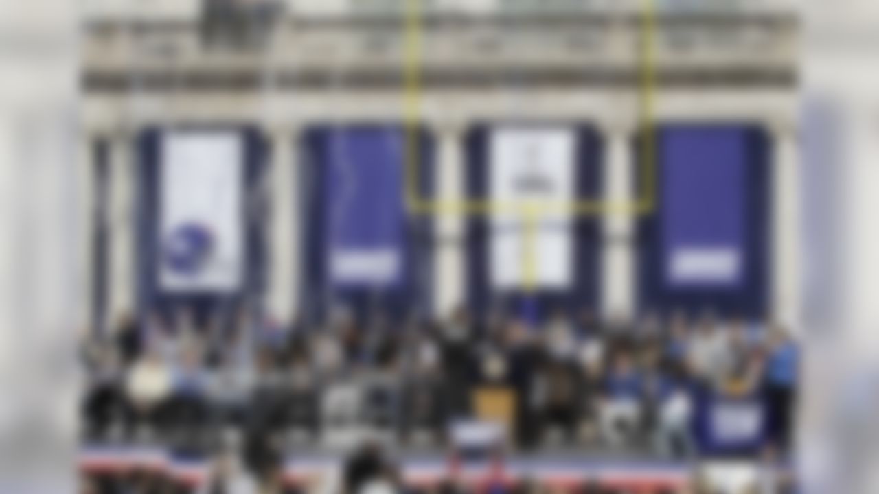 Confetti falls down from above during a ceremony for the NFL football Super Bowl XLVI champion New York Giants at City Hall in New York, Tuesday, Feb. 7, 2012. (AP Photo/Kathy Willens)