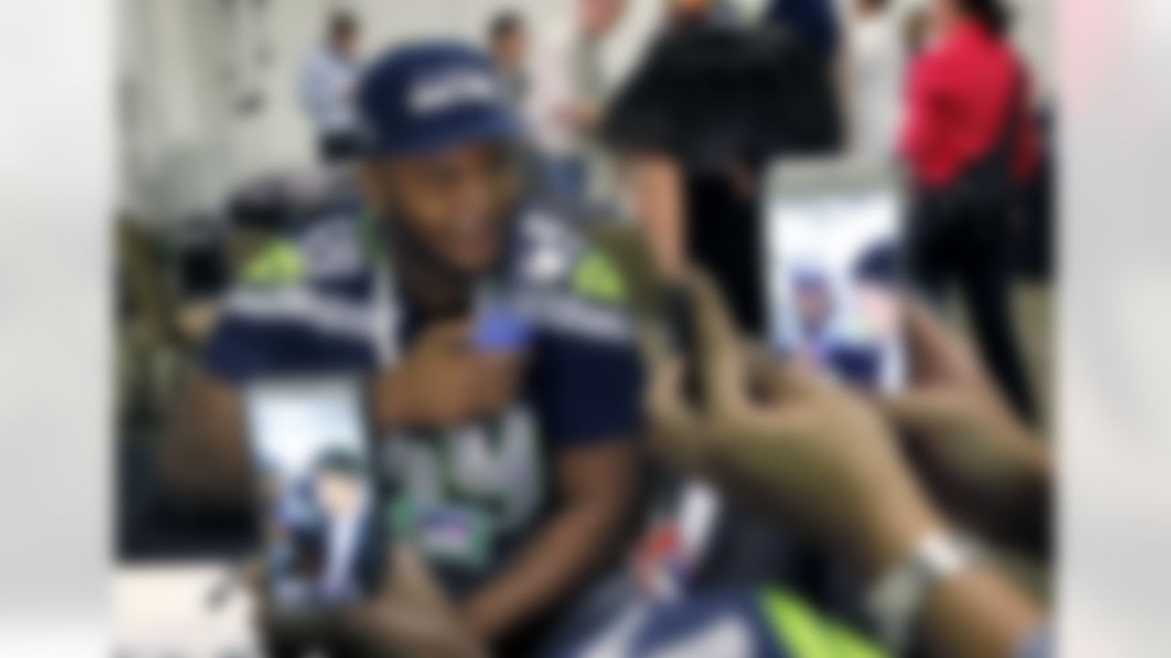 Seattle Seahawks' Jimmy Stanton conducts a mock interview with a water bottle during an interview for NFL Super Bowl XLIX football game, Thursday, Jan. 29, 2015, in Phoenix. The Seahawks play the New England Patriots in Super Bowl XLIX on Sunday, Feb. 1, 2015. (AP Photo/Matt York)