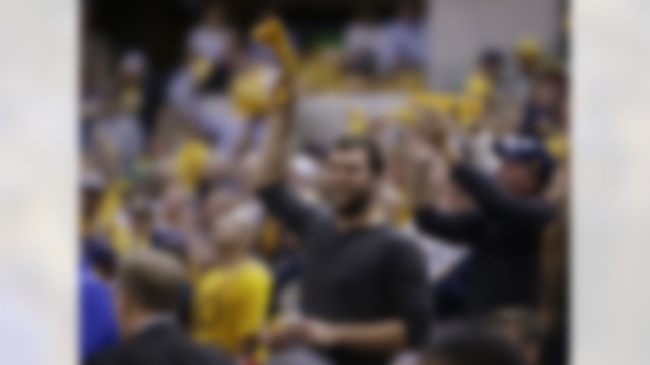 Indianapolis Colts quarterback Andrew Luck cheers for the Indiana Pacers during the second half of Game 4 of an NBA first-round playoff basketball series against the Toronto Raptors, Saturday, April 23, 2016, in Indianapolis. Indiana won 100-83. (AP Photo/Darron Cummings)