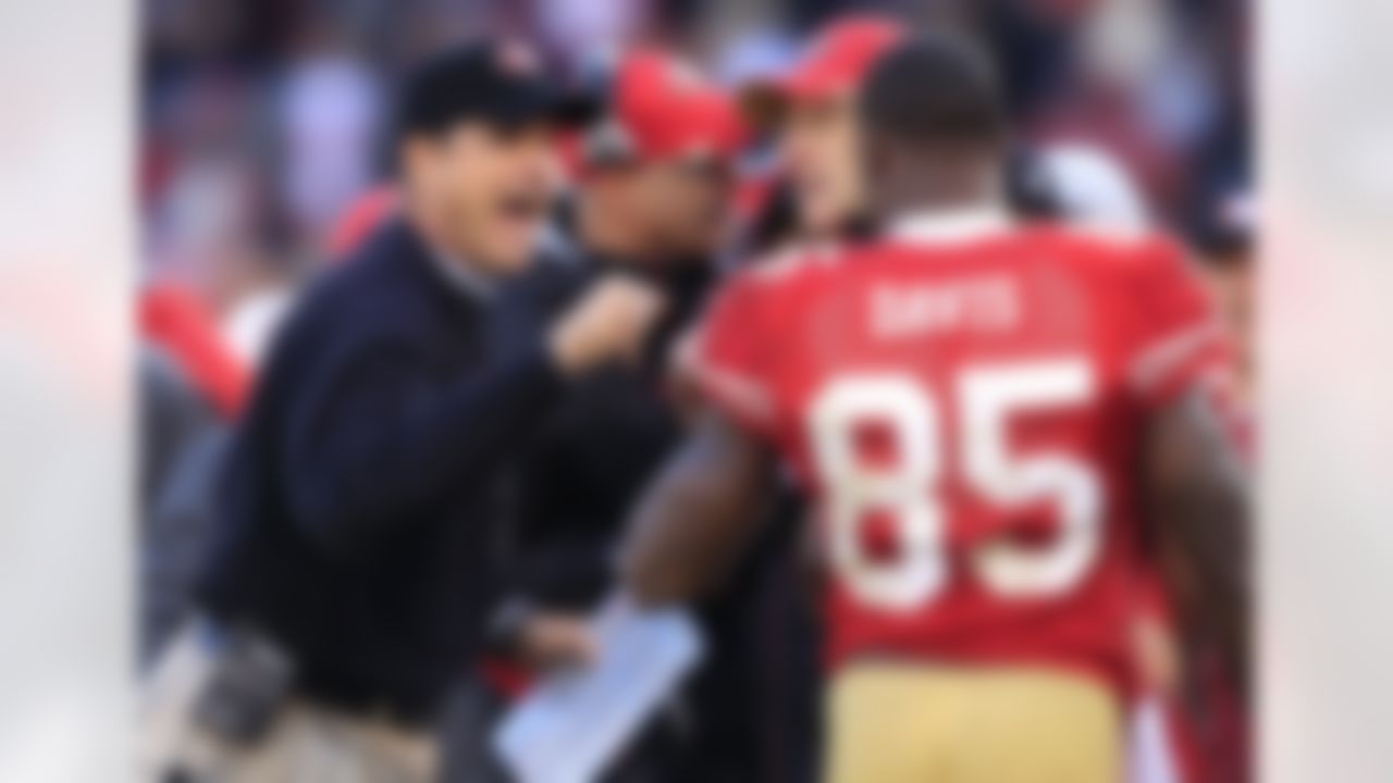 San Francisco 49ers head coach Jim Harbaugh celebrates with tight end Vernon Davis (85) after Davis scored on an 18-yard touchdown reception against the Arizona Cardinals in the third quarter of an NFL football game in San Francisco, Calif., Sunday, Nov. 20, 2011. (AP Photo/Marcio Jose Sanchez)