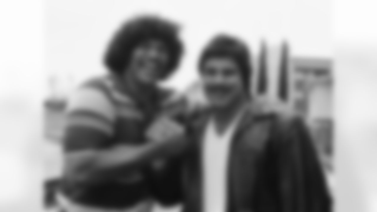 Anthony Munoz, (left), and teammate Brad Budde of the University of Southern California Trojans congratulate each other on campus, Tuesday, April 29, 1980 in Los Angeles after they were selected in the first round as NFL draft choices. Munoz, an offensive tackle, was picked third by the Cincinnati Bengals in the first round and Budde, an offensive guard, was chosen 11th by the Kansas City Chiefs. (Associated Press)