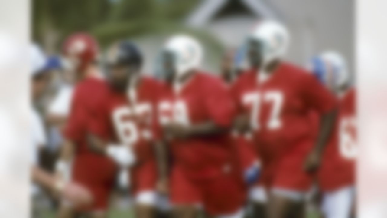 Pittsburgh Steelers center Dermontti Dawson (63), Miami Dolphins guard Keith Sims (69), and Dolphins tackle Richmond Webb (77) at practice for the NFL Pro Bowl on January 31, 1996, in Honolulu, Hawaii. (National Football League)