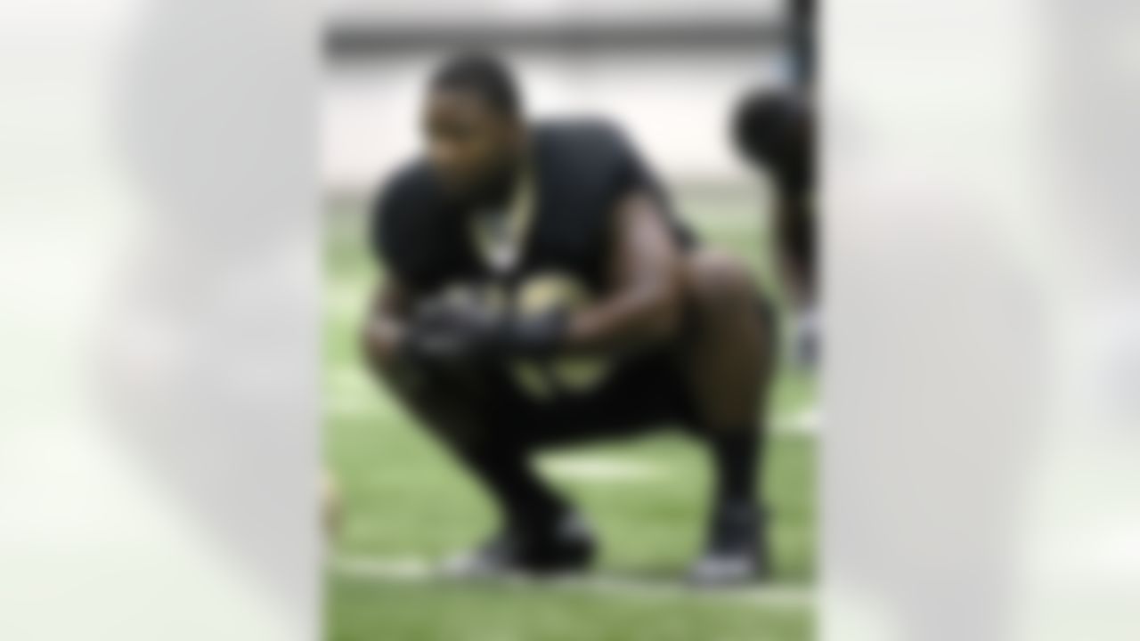 New Orleans Saints linebacker Curtis Lofton stretches during NFL football training camp in Metairie, La., Thursday, July 26, 2012. (AP Photo/Gerald Herbert)