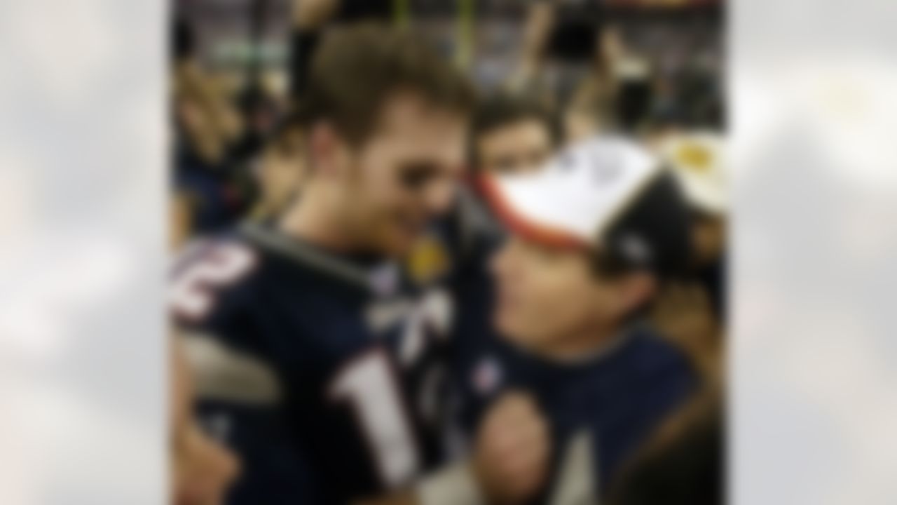 New England Patriots quarterback Tom Brady (12) and head coach Bill Belichick embracing after defeating the Carolina Panthers 32-29 in Super Bowl XXXVIII at the Reliant Stadium in Houston, TX Sunday Feb. 1, 2004. (AP Photo/David J. Phillip, File)