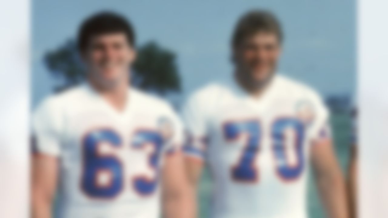 HOUSTON - AUGUST 2: Guard Mike Munchak #63 of the Houston Oilers and tackle Dean Steinkuhler, tackle Harvey Salem #73 and guard Bruce Matthews pose during training camp on August 2, 1984 in Houston, Texas. (Photo by NFL Photos/Getty Images)