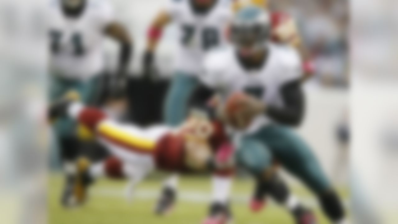 In this Oct. 3, 2010 file photo, Washington Redskins safety LaRon Landry stretches to reach Philadelphia Eagles quarterback Michael Vick during the first half of an NFL football game in Philadelphia. (AP Photo/Matt Slocum, File)