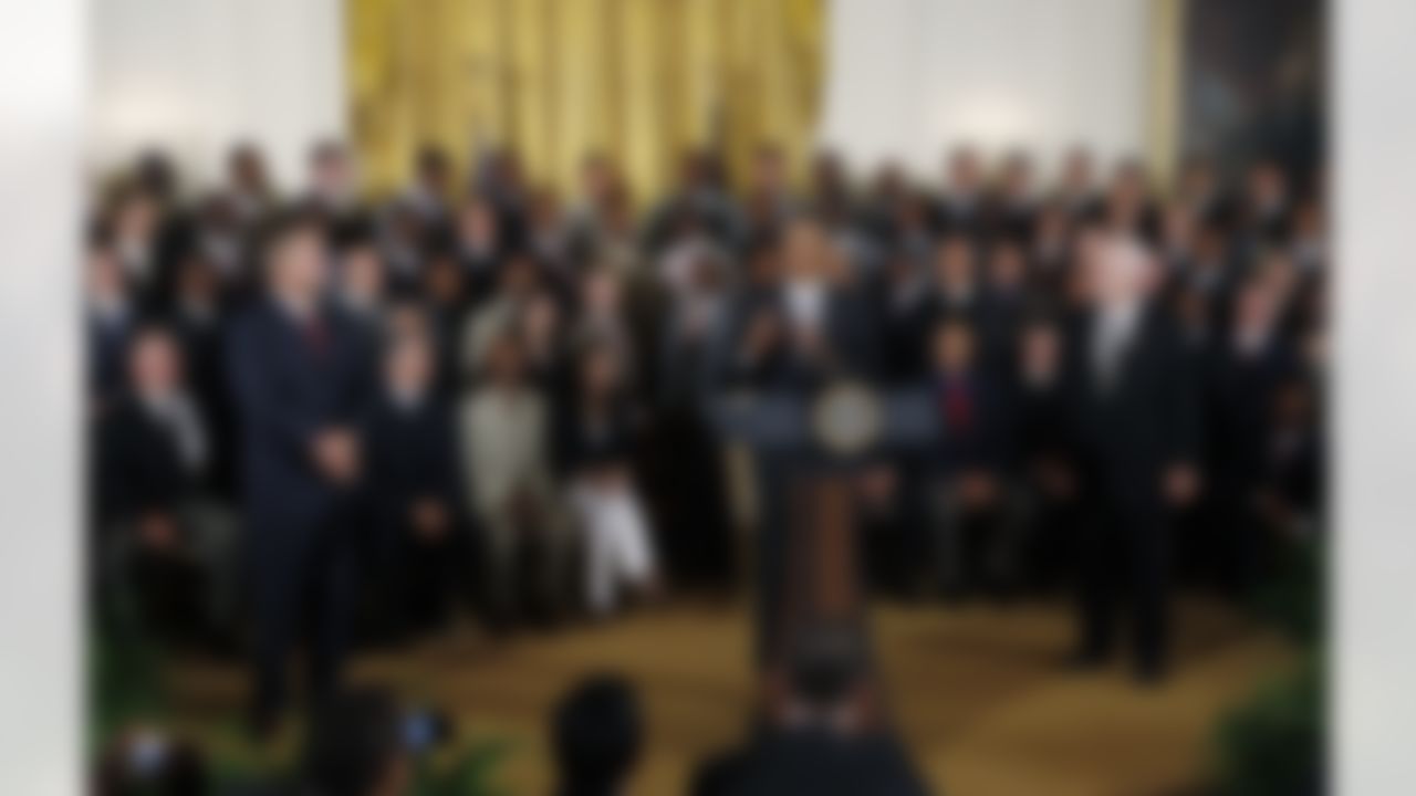 President Barack Obama stands with the 2009 NFL Super Bowl Football Champions New Orleans Saints during a ceremony in the East Room of the White House in Washington, Monday, Aug. 9, 2010. Standing at left is coach Sean Payton and at right is team owner Tom Benson. (AP Photo/Charles Dharapak)