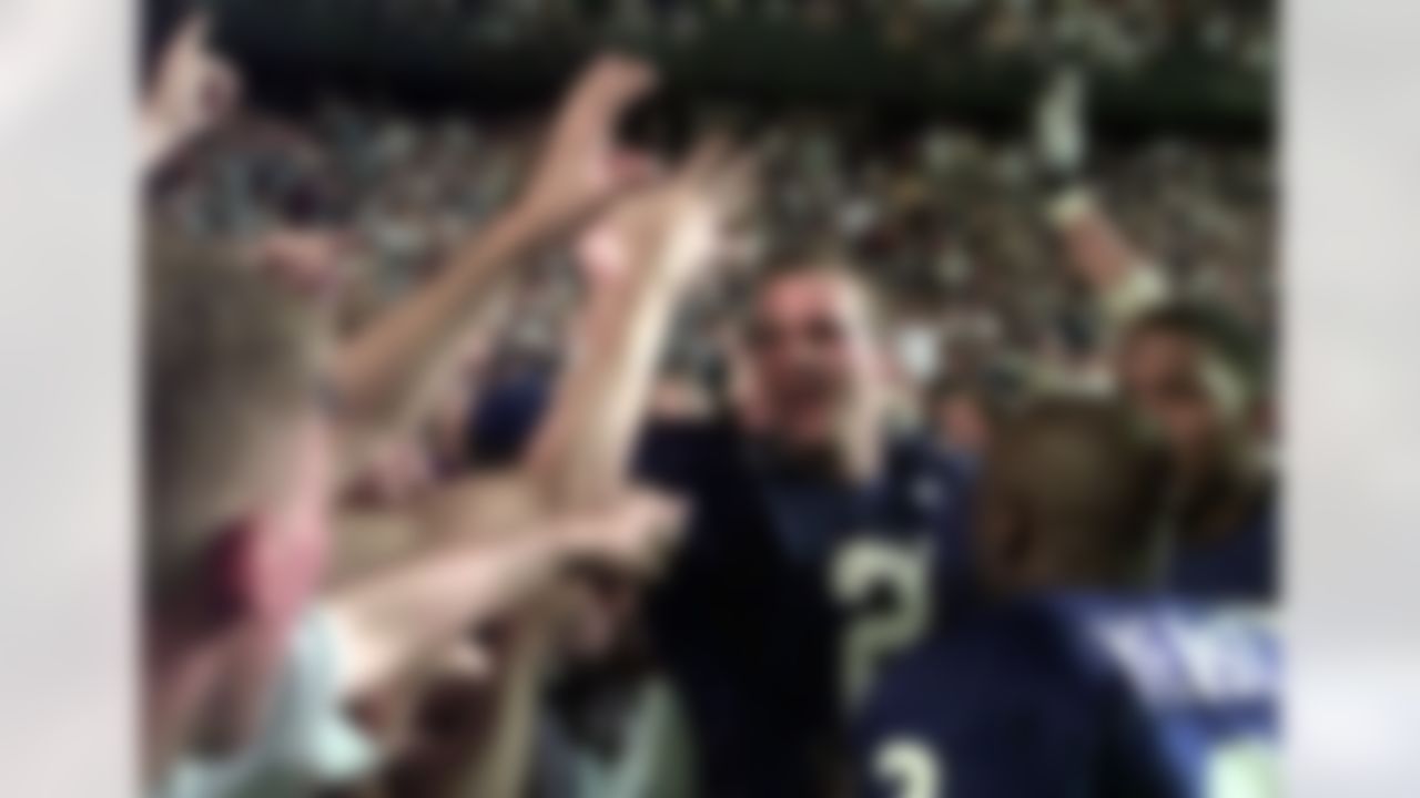 Kentucky quarterback Tim Couch (2) gets congratulations from the Wildcats fans after defeating LSU 39-36 Saturday night, Oct. 17, 1998 in Baton Rogue, La. (AP Photo/Bill Haber)