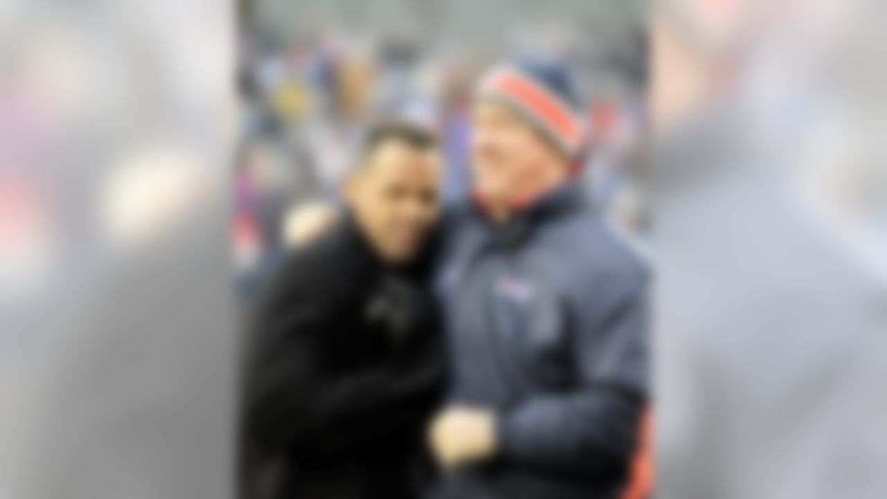 Buffalo Bills alumni Andre Reed, left, greets Jim Kelly during halftime of the Miami Dolphins and Buffalo Bills NFL football game in Orchard Park, N.Y., Sunday, Dec. 18, 2011. (Gary Wiepert/Associated Press)